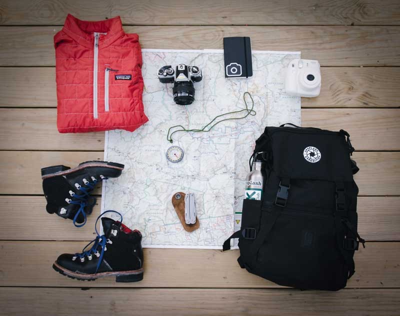 hiking travel gear laid out to pack