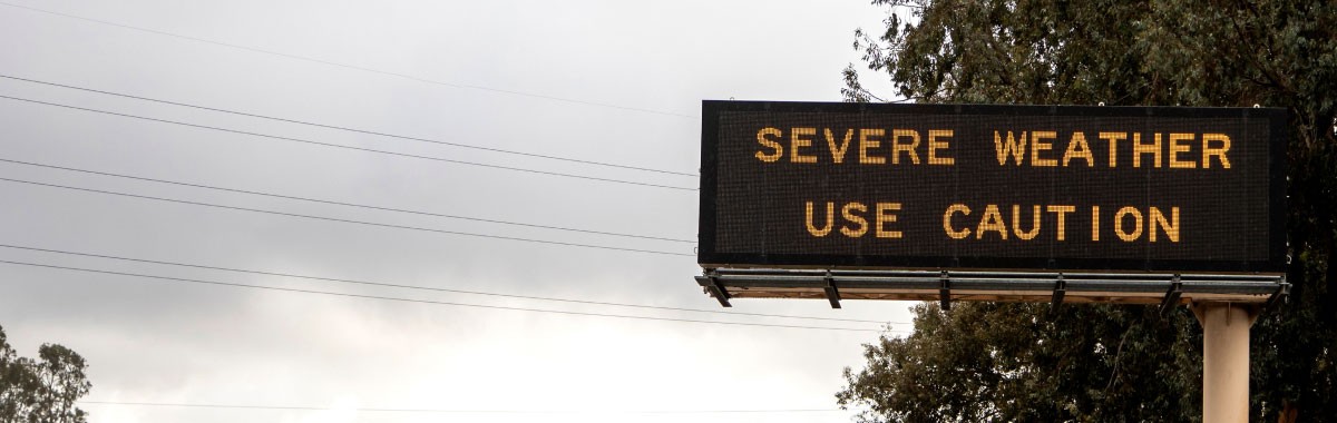 highway sign that reads severe weather use caution