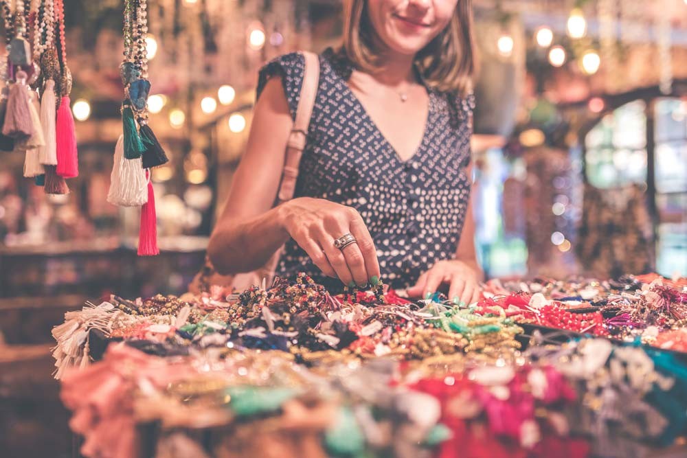 woman shopping in a Bali market for jewelry