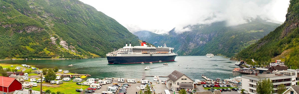 cruise ship in the harbor of a fjord in norway