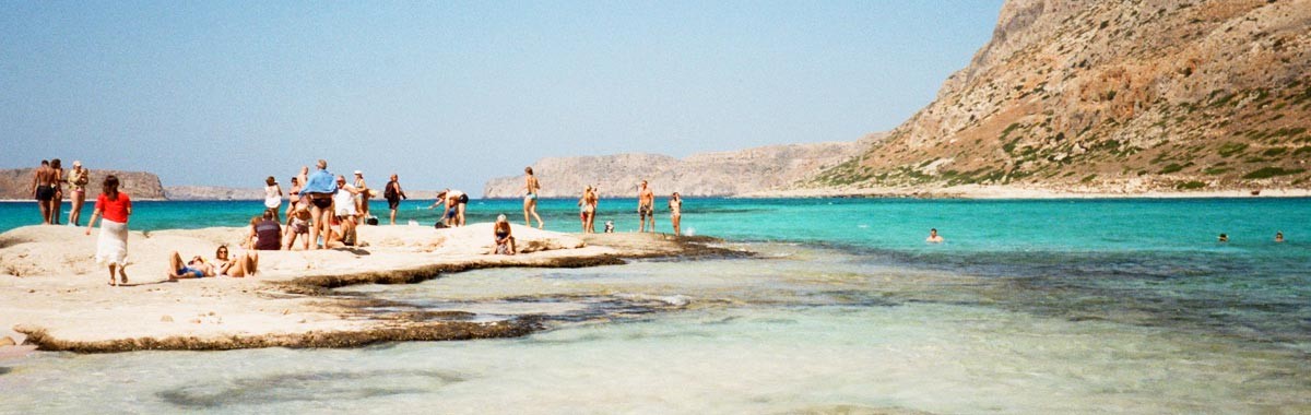 people on spring vacation on beach at Balos Beach, Crete