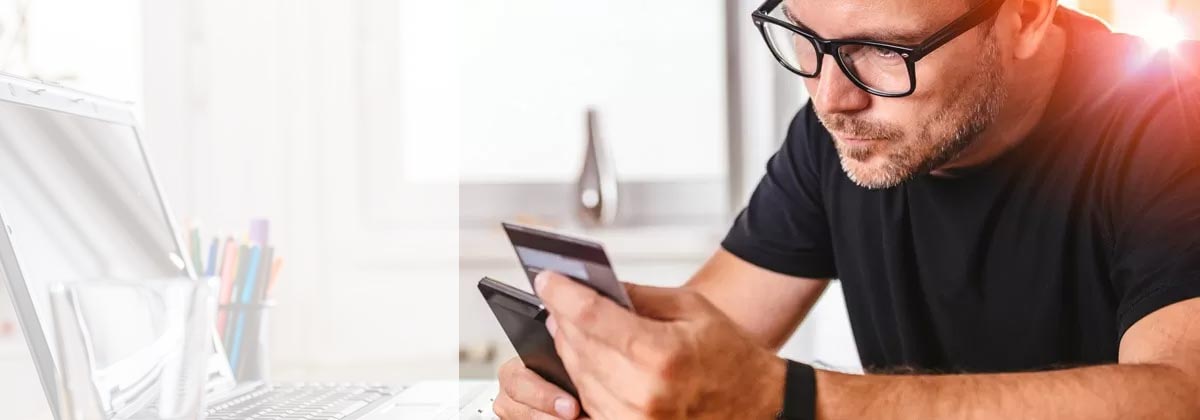 man getting a travel insurance cost quote on his phone