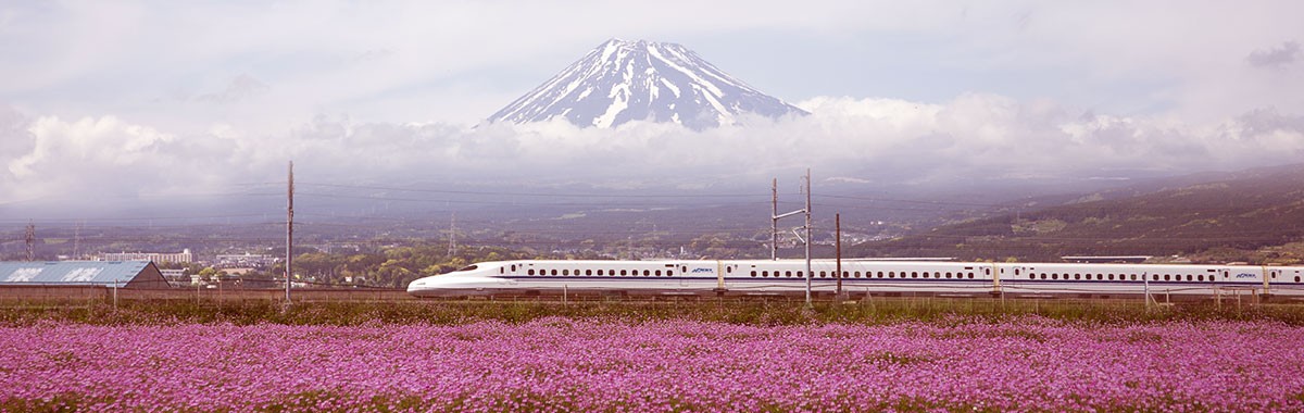 Shinkanse bullet train speeding through Japan past Mt Fuji